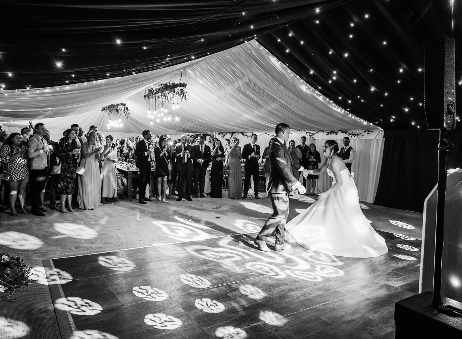 Black and white first dance wedding photo showing a second photographer may not be necessary for a wedding with 80 guests.