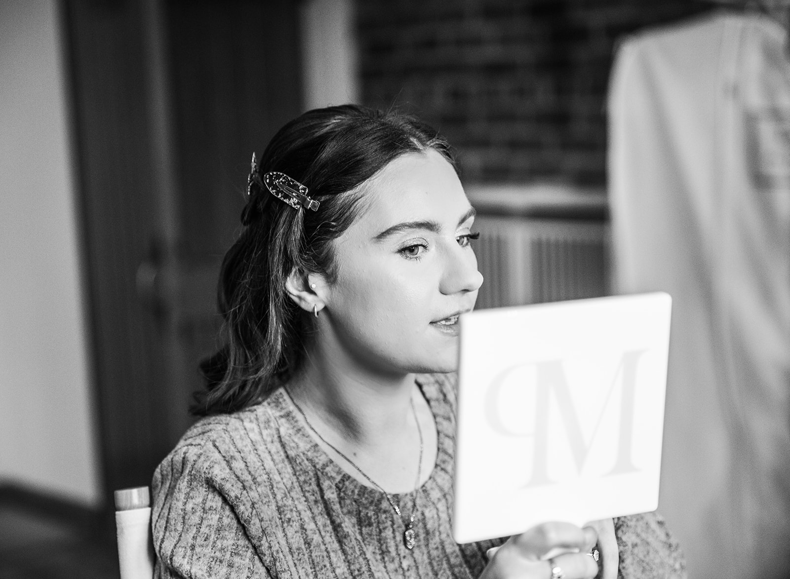 Documentary wedding photo of couple on Painswick Beacon to show editorial documentary photography style.