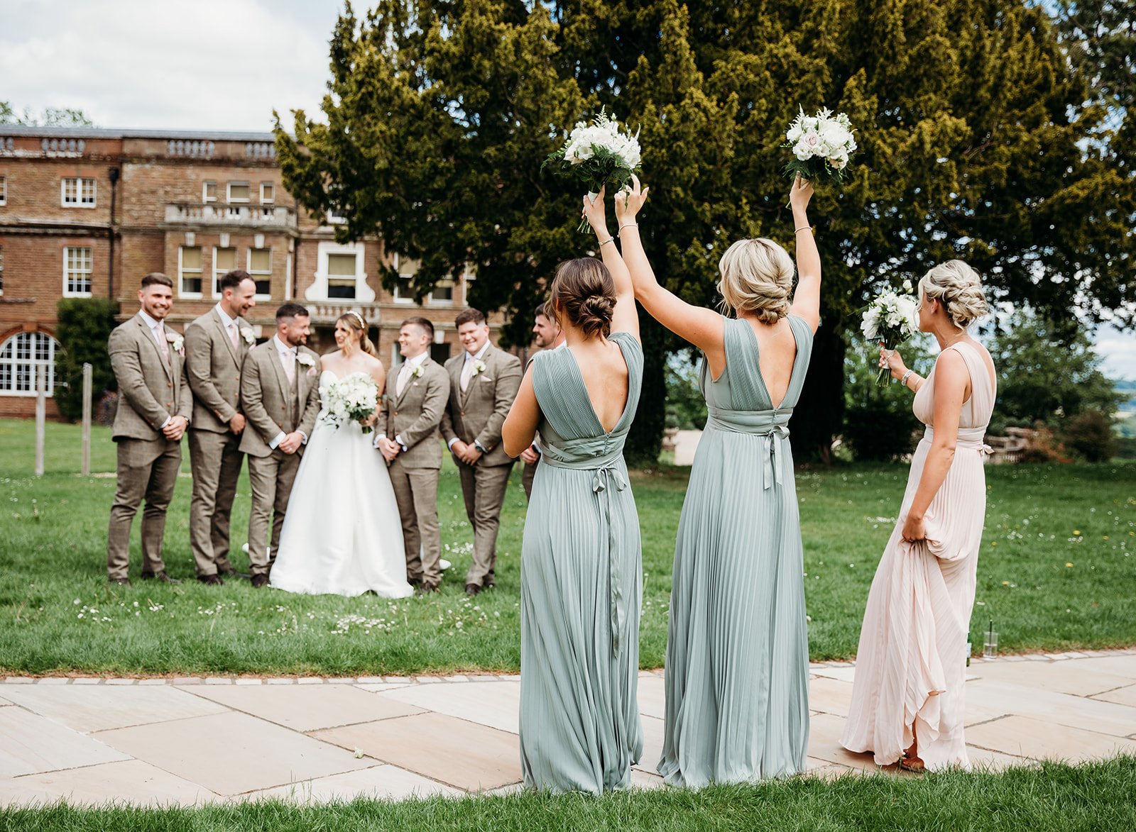 Bridesmaids and Groomsmen outside Bredenbury Court Barns for group photos