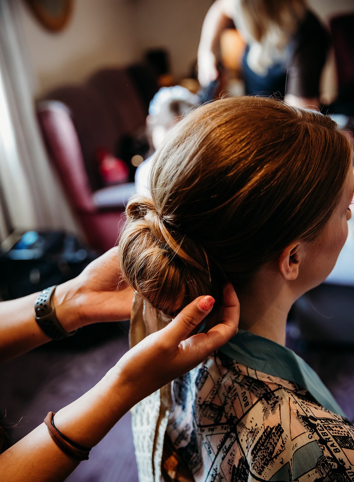 Pittville Pump Room bride getting her hairstyle done for her wedding in Cheltenham