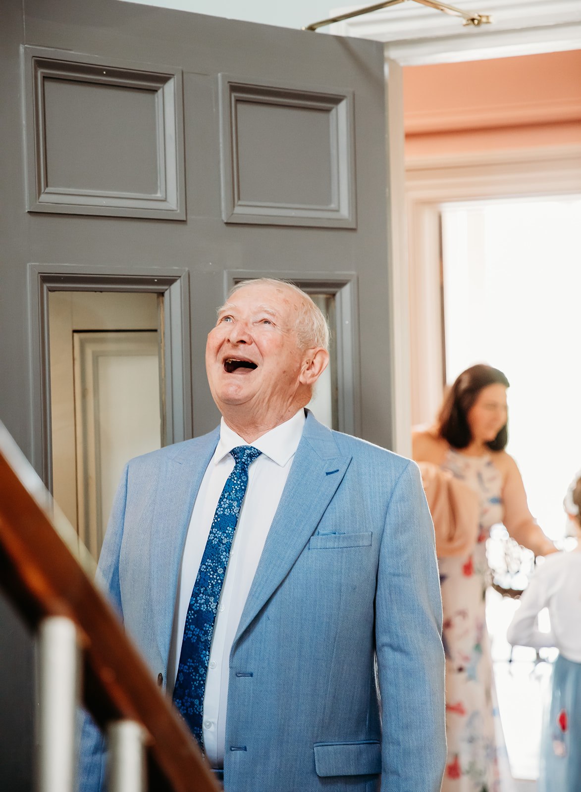 Happy father of the bride seeing the bride for the first time in Cheltenham
