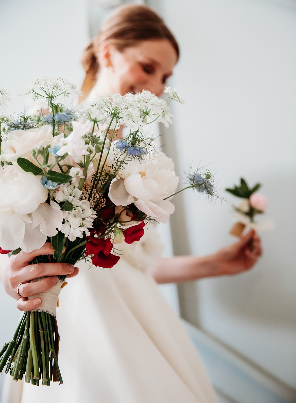 Bride walking with bridal bouquet for her Pittville Pump Room wedding ceremony