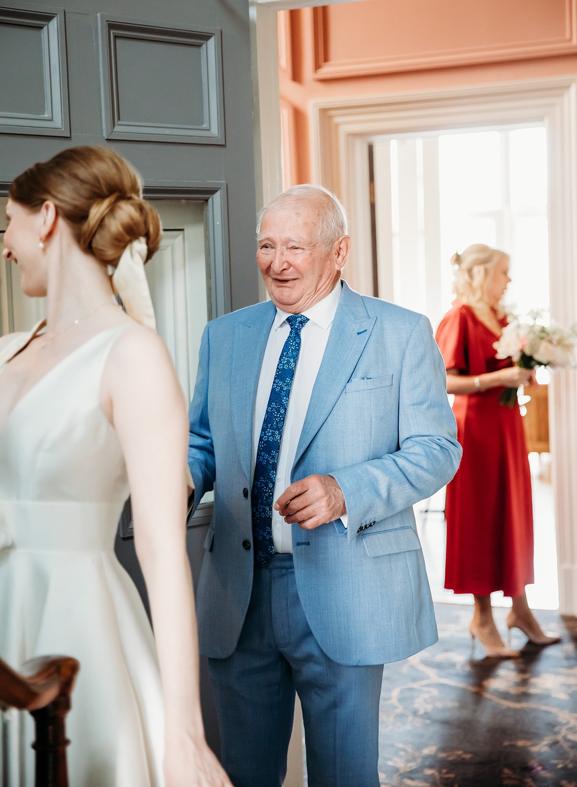Father of the bride seeing the bride's wedding dress in Cheltenham