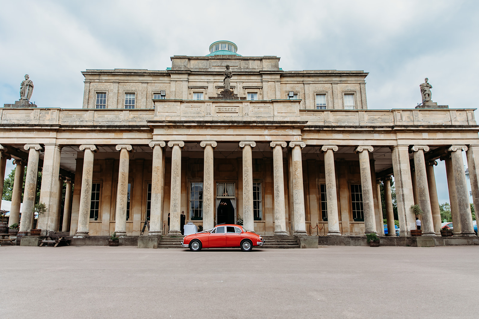 Documentary wedding photo of couple on Painswick Beacon to show editorial documentary photography style.