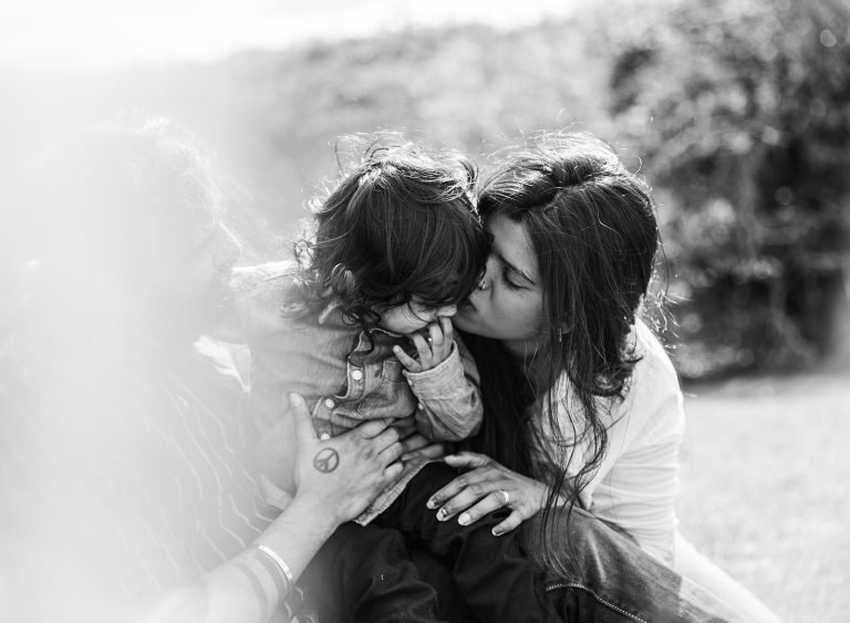 Family black and white photograph at crickley hill candid moment